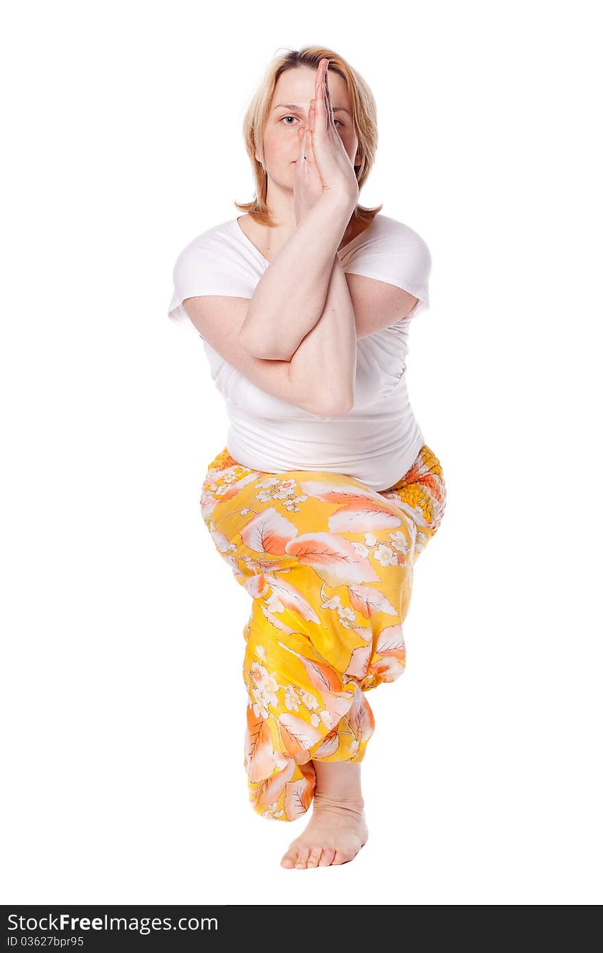 Young woman doing yoga exercise. isolated