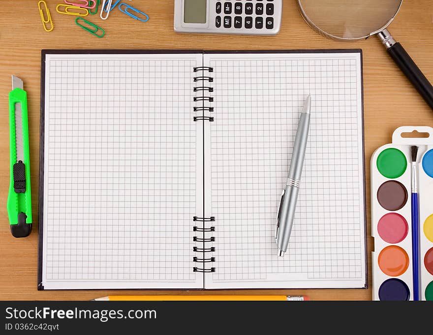 School Accessories And Notebook On Table