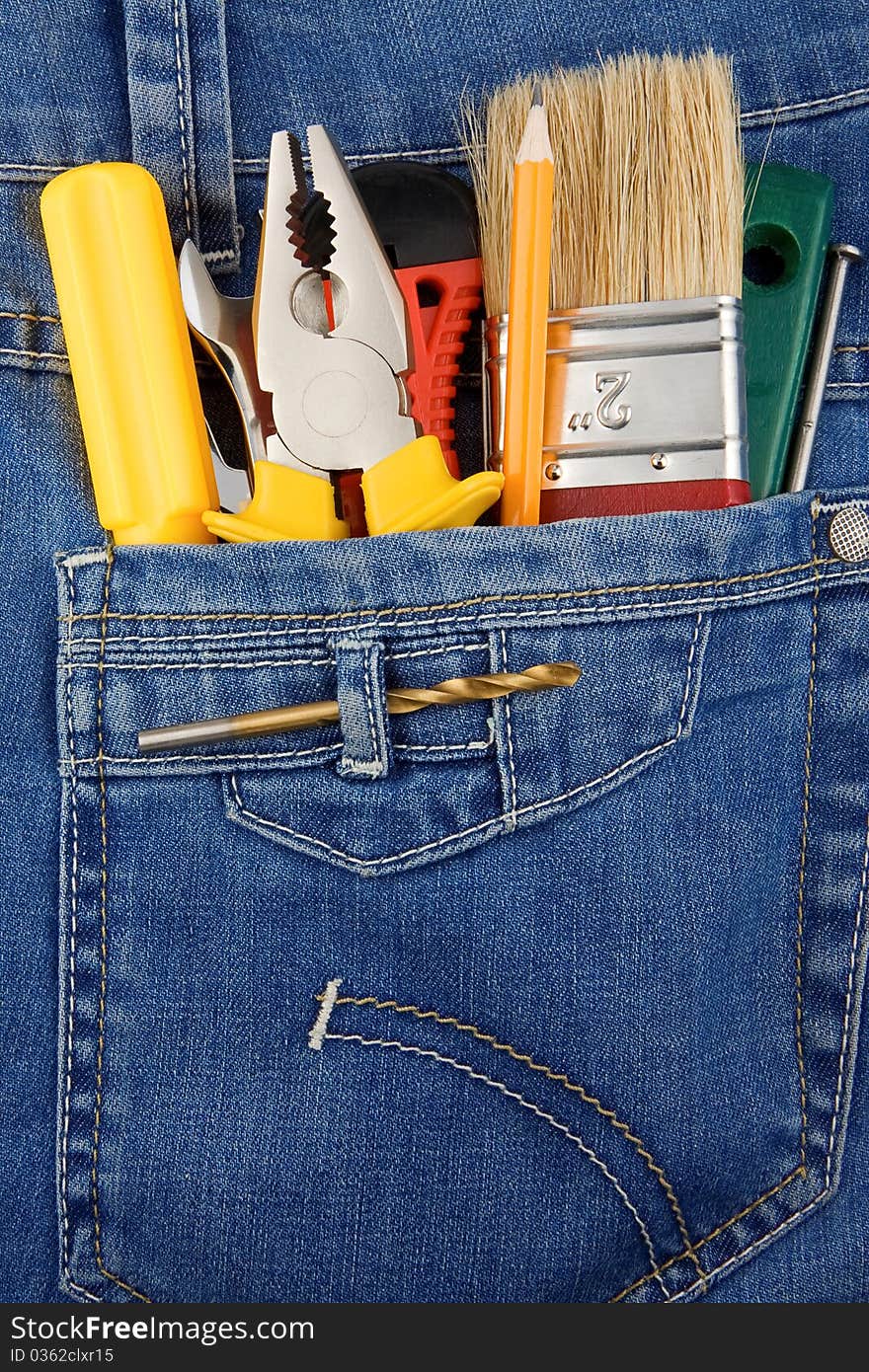 Tools and instruments in blue jeans pocket