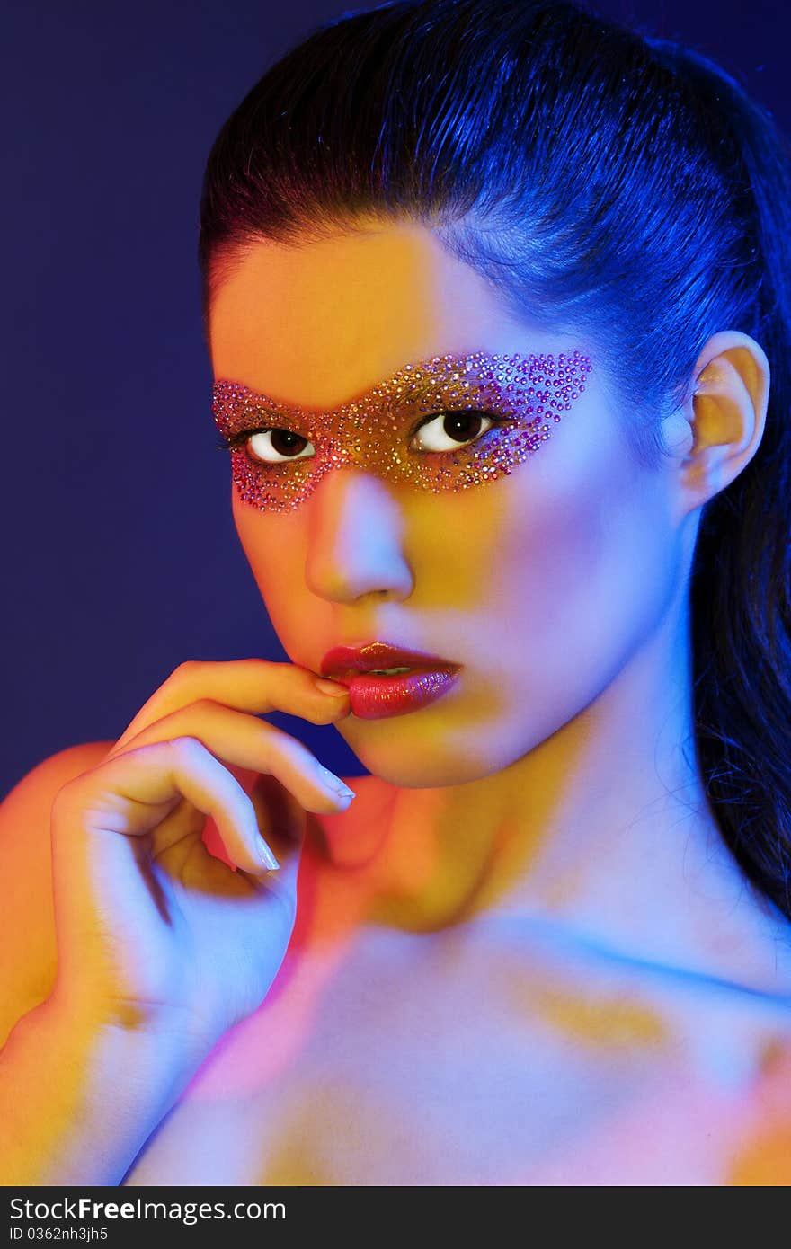 Portrait of beautiful woman with creative make-up, colour filters were used