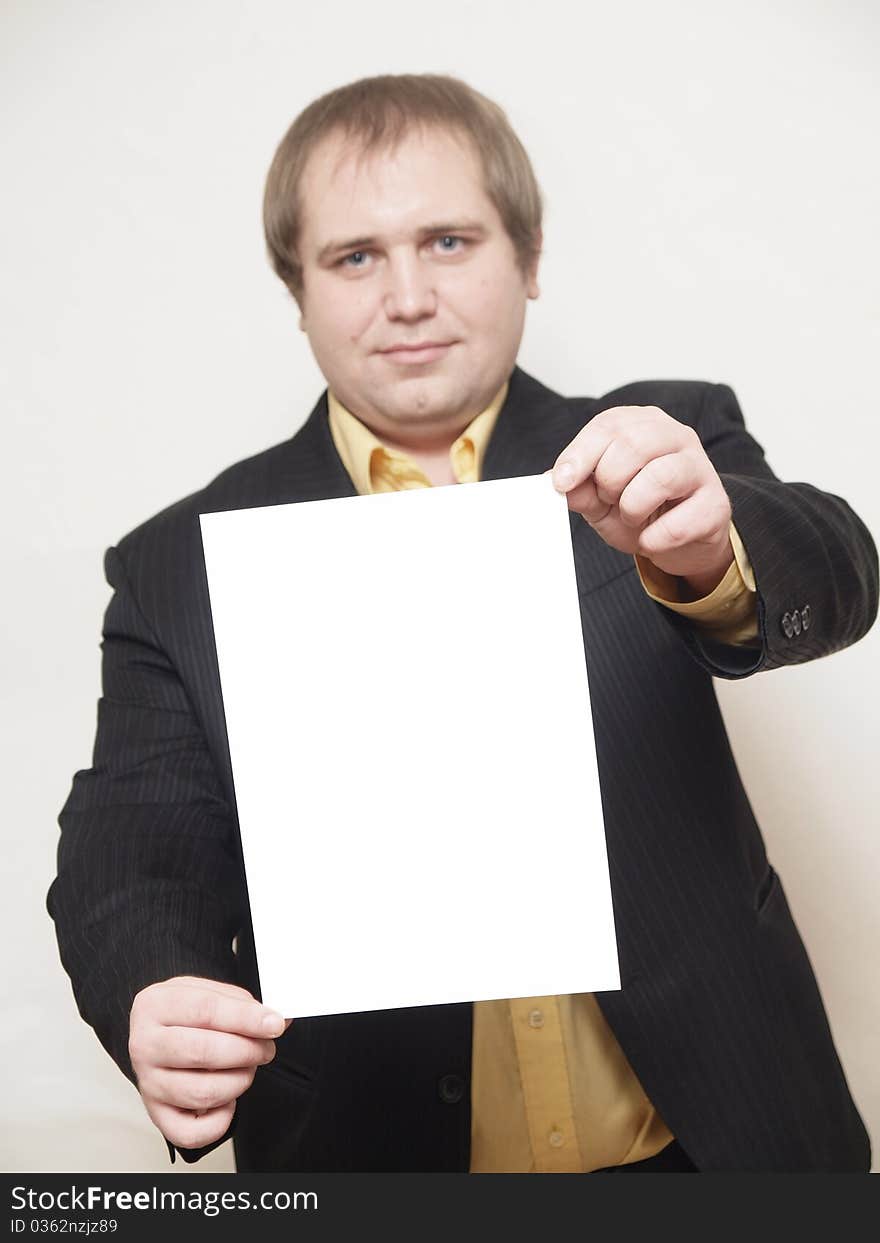 ManThe businessman of average years costs on a white background