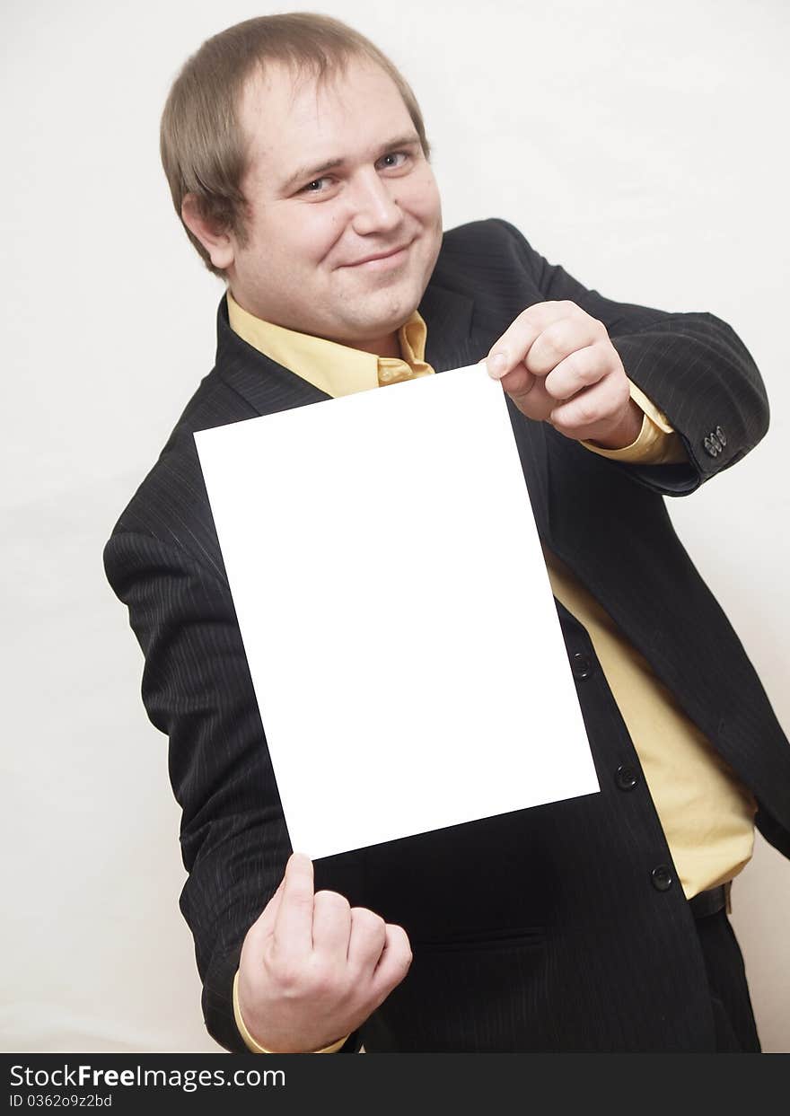 ManThe businessman of average years costs on a white background