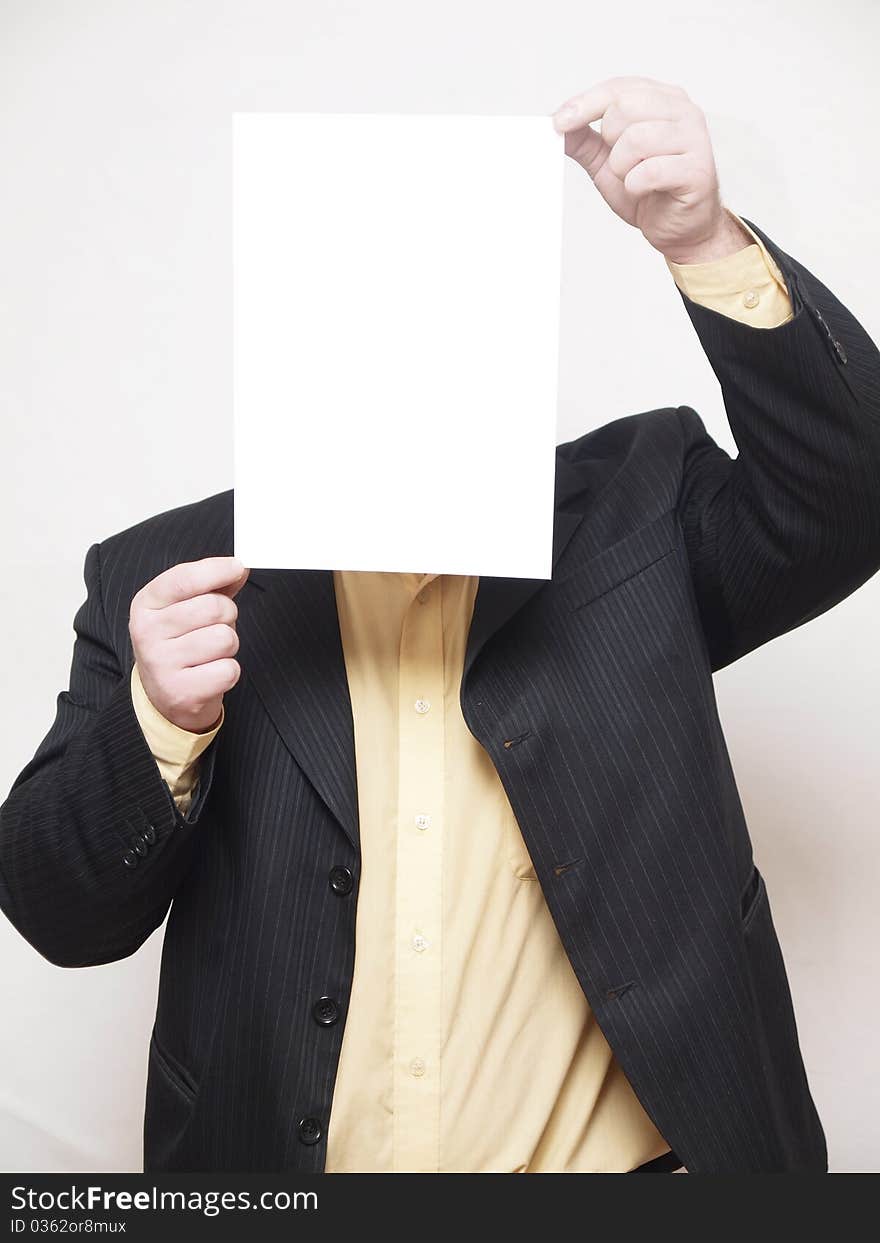 ManThe businessman of average years costs on a white background