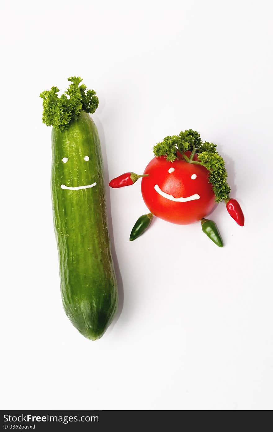 Smiling tomato and cucumber