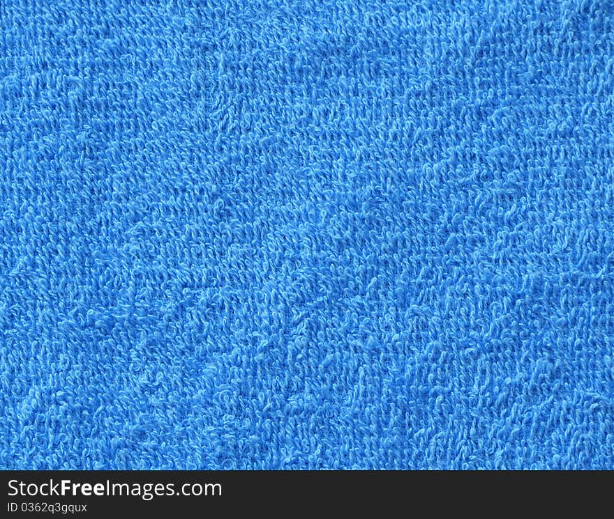 Bright blue terrycloth material for use as background or design elements. Bright blue terrycloth material for use as background or design elements