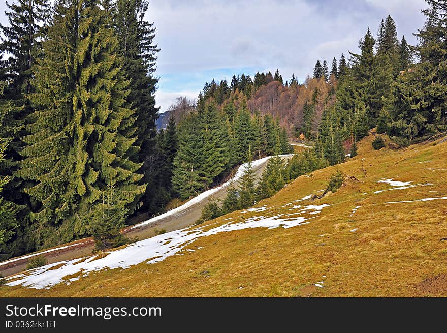 High road in snowy mountains in winter time