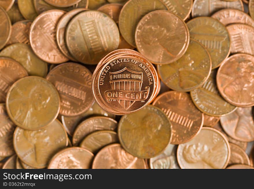 A tower of new pennies arise from older ones. A tower of new pennies arise from older ones