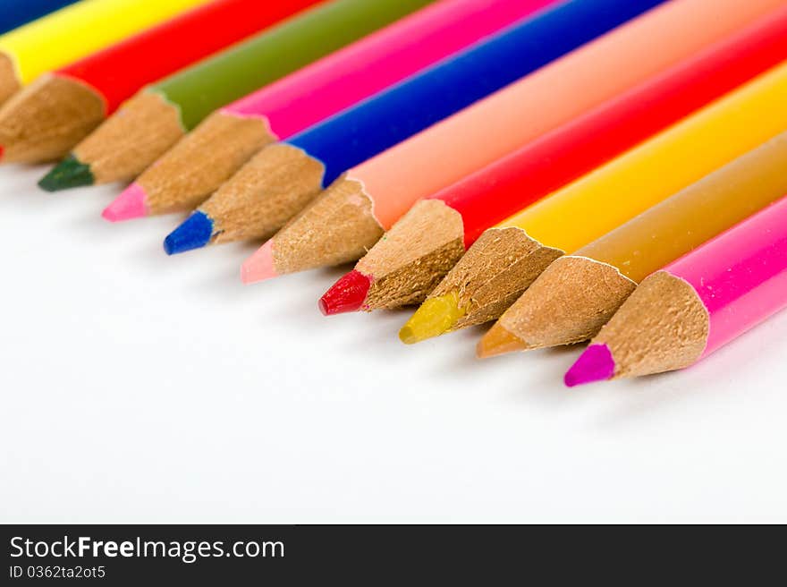 Colored pencils lined up in an angled row