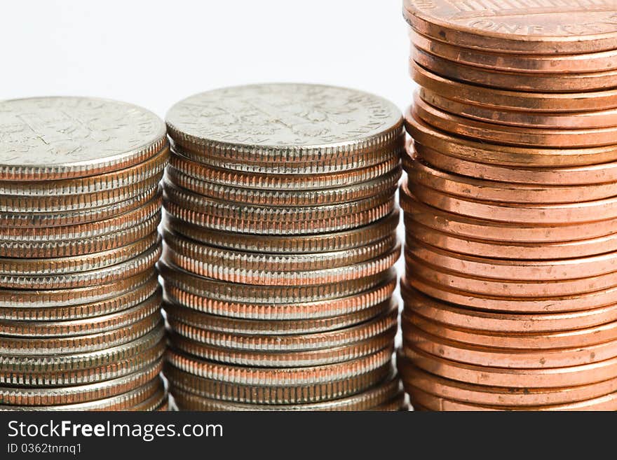 A tower of dimes and pennies against a white background. A tower of dimes and pennies against a white background