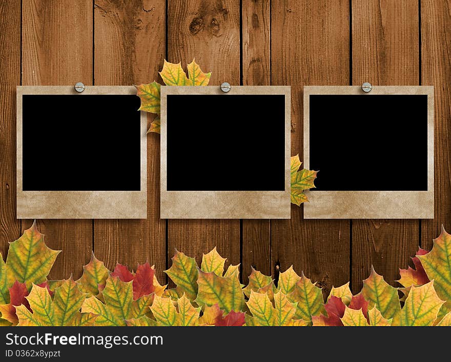 Card for the holiday with autumn leaves on the wooden background. Card for the holiday with autumn leaves on the wooden background