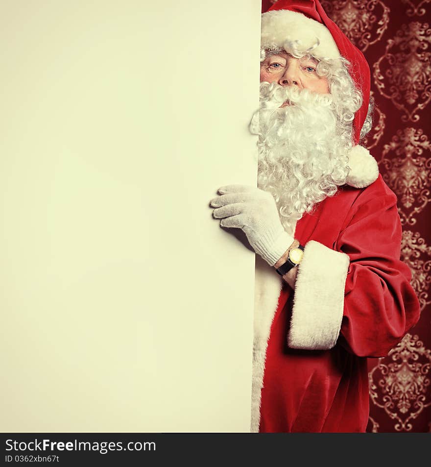 Portrait of Santa Claus holding white board. Christmas. Portrait of Santa Claus holding white board. Christmas.