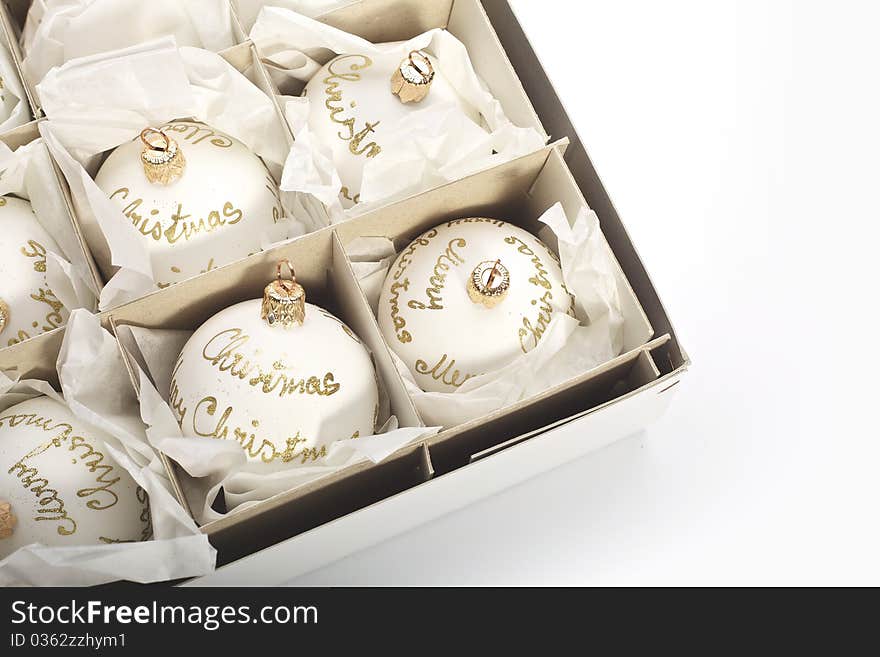 Close-up of White Christmas balls in box