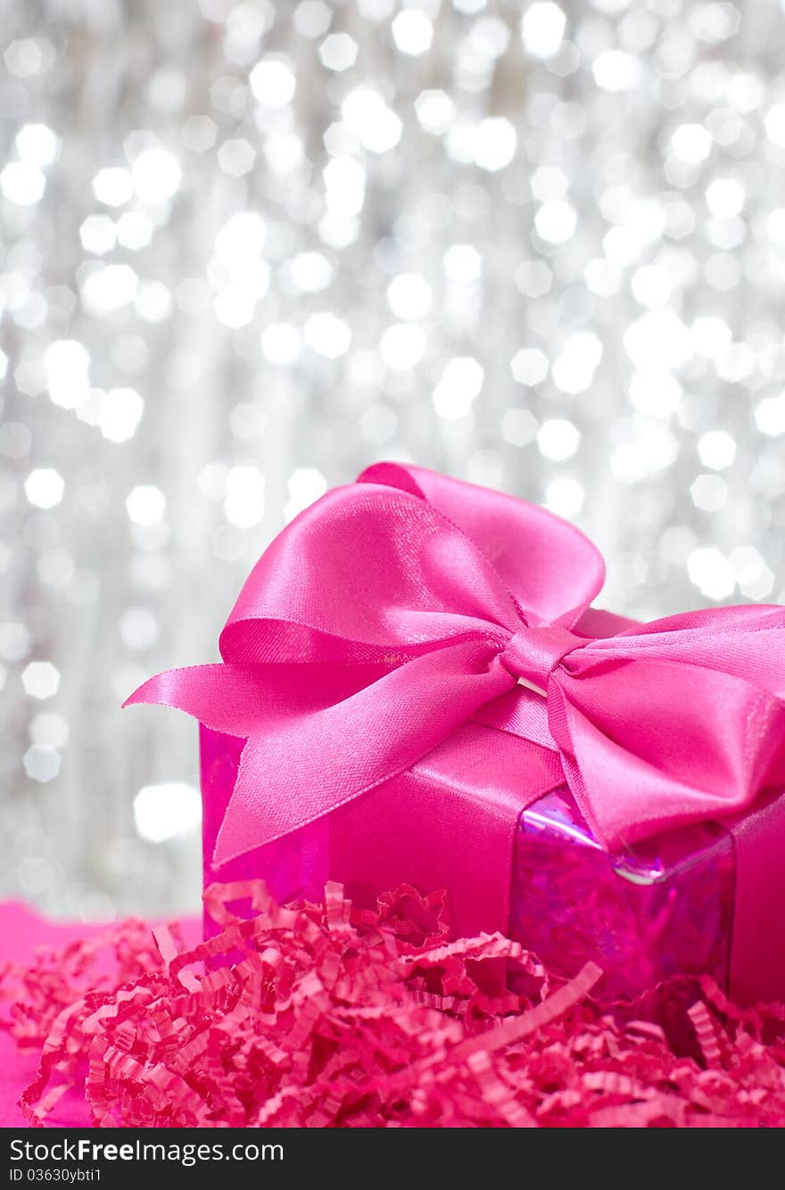 Pink box on shiny decoration. Pink box on shiny decoration