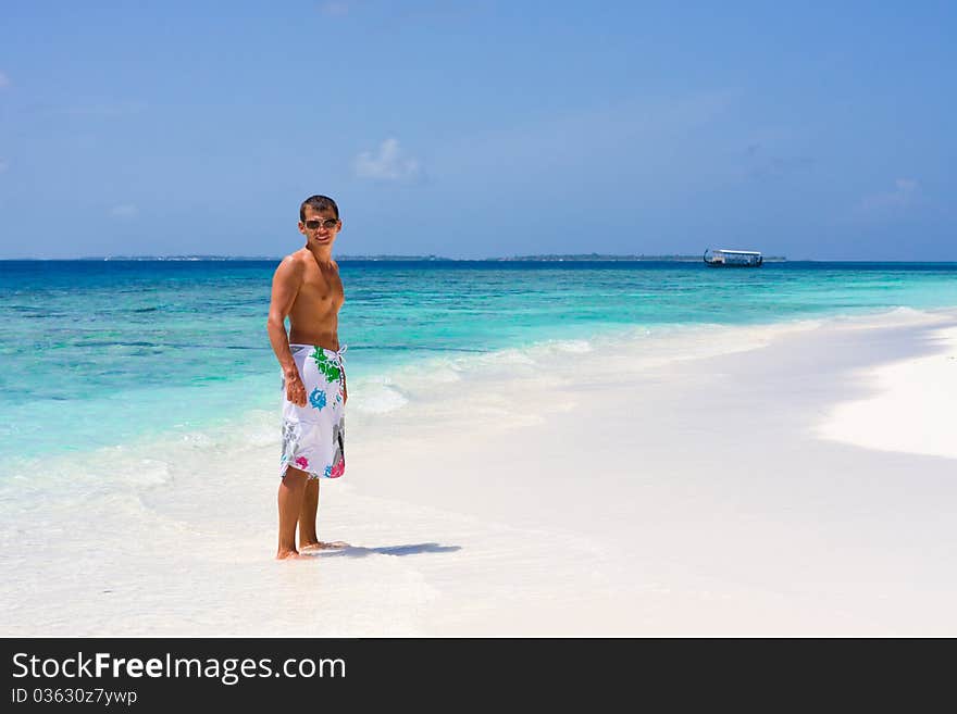 Young man on a tropical beach