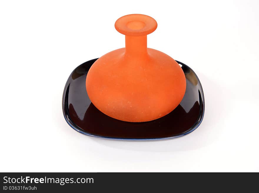 Colored glass vases on a white background