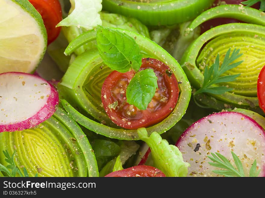 Fresh spring salad in bowl with vinegar dessing close up. Fresh spring salad in bowl with vinegar dessing close up