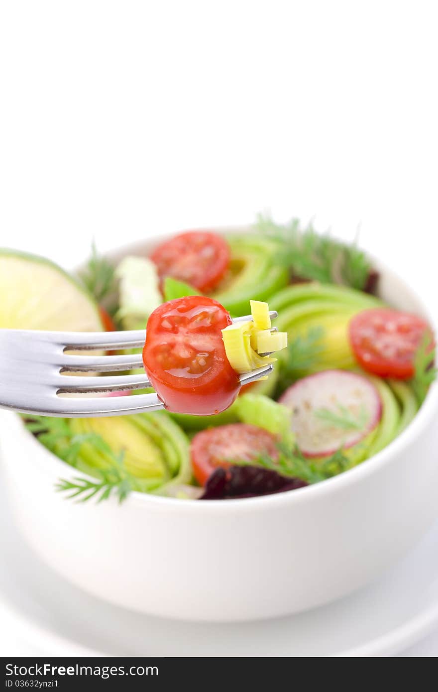 Some bits of salad on the fork close up. Some bits of salad on the fork close up