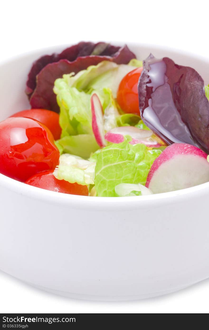 Fresh spring salad in bowl with vinegar dessing. Fresh spring salad in bowl with vinegar dessing