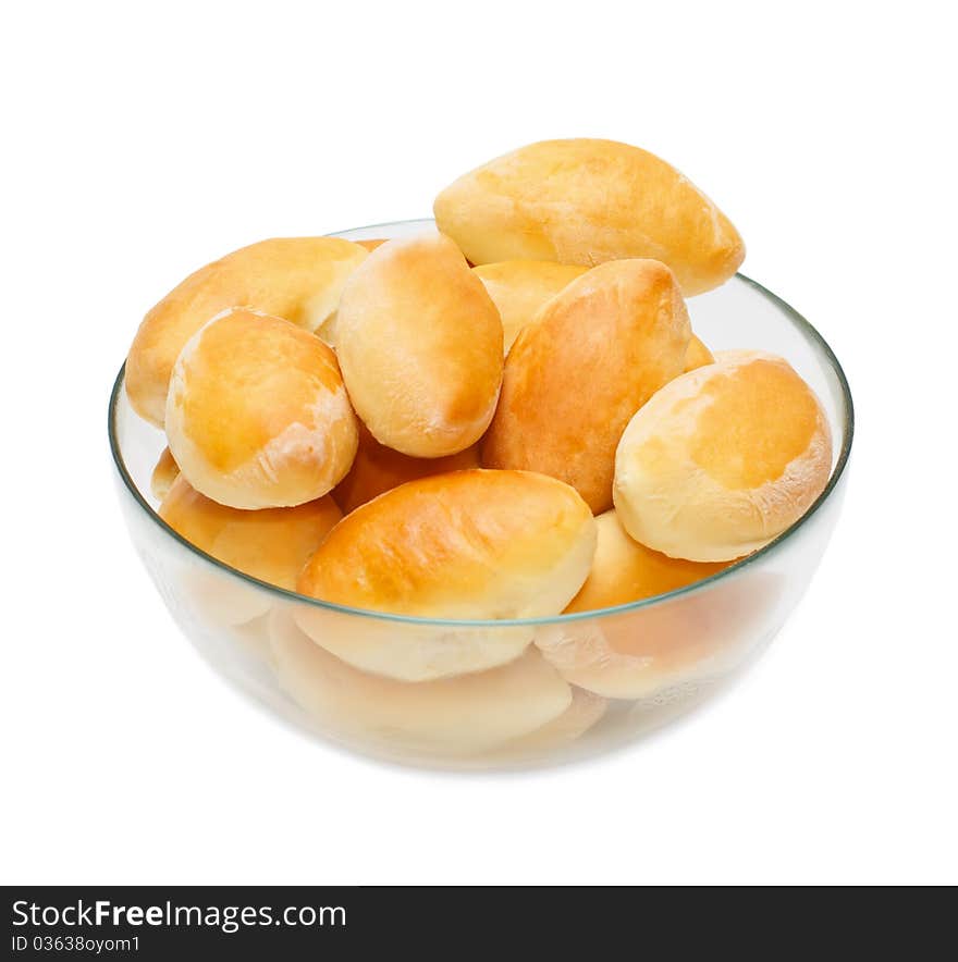 Full cup of warm homemade pasties on white background