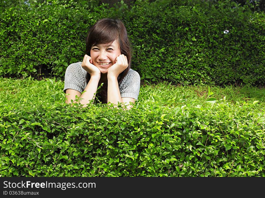 Attractive asian girl smiling in the park