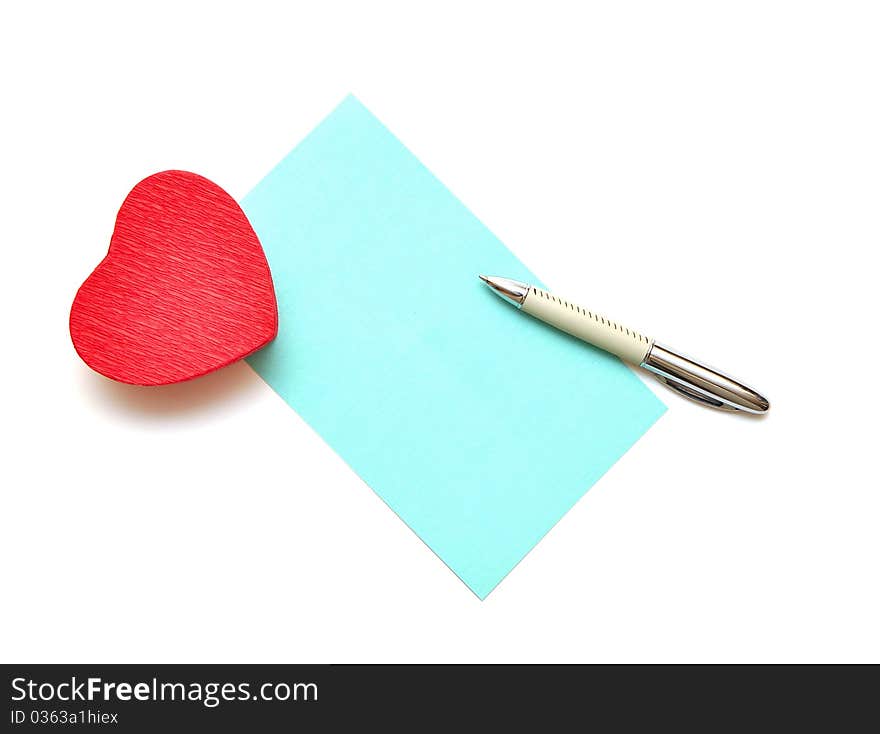 Blank paper for your text and red gift box in heart shape on white