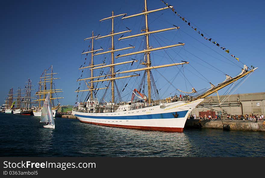 Tall sailing boats tied up for a race