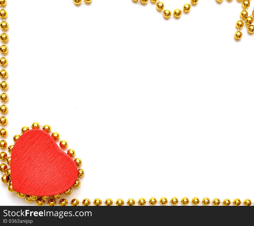 Red heart on a background of a yellow beads. Red heart on a background of a yellow beads