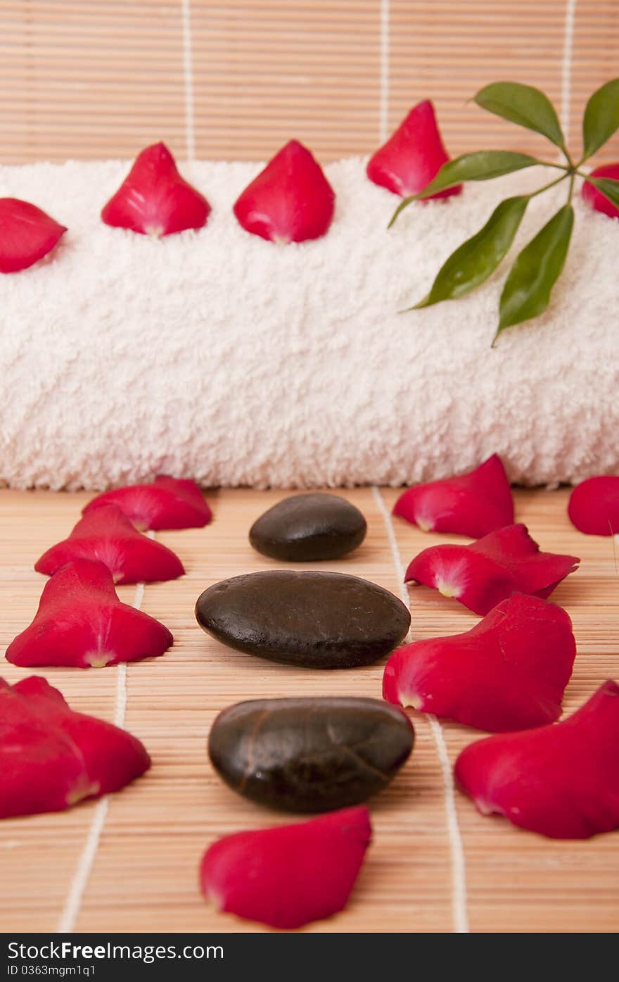 Spa stones with flower petals