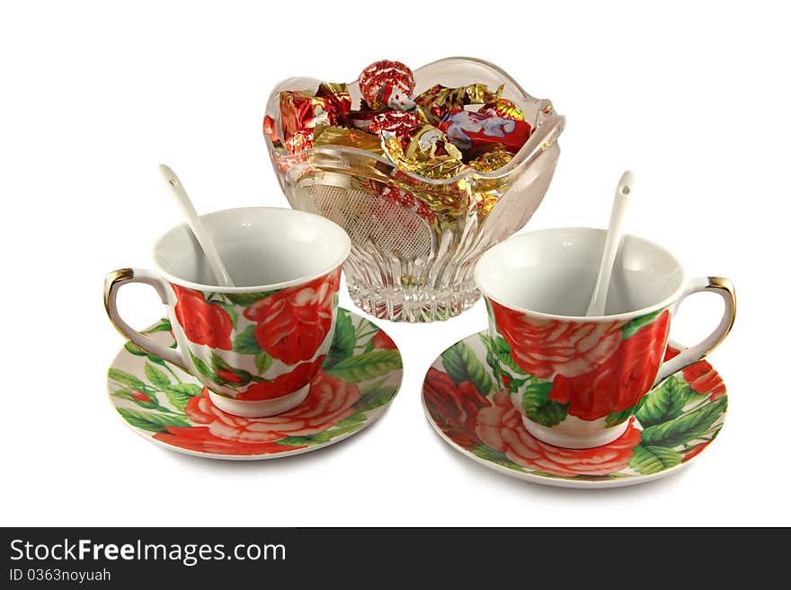 Two tea cups and vase with sweets. Two tea cups and vase with sweets