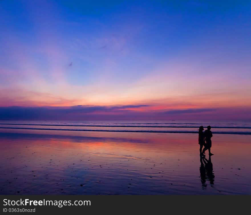 Two people at sunset