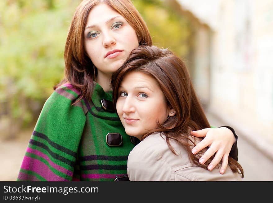 Autumn portrait in sity in cloak women