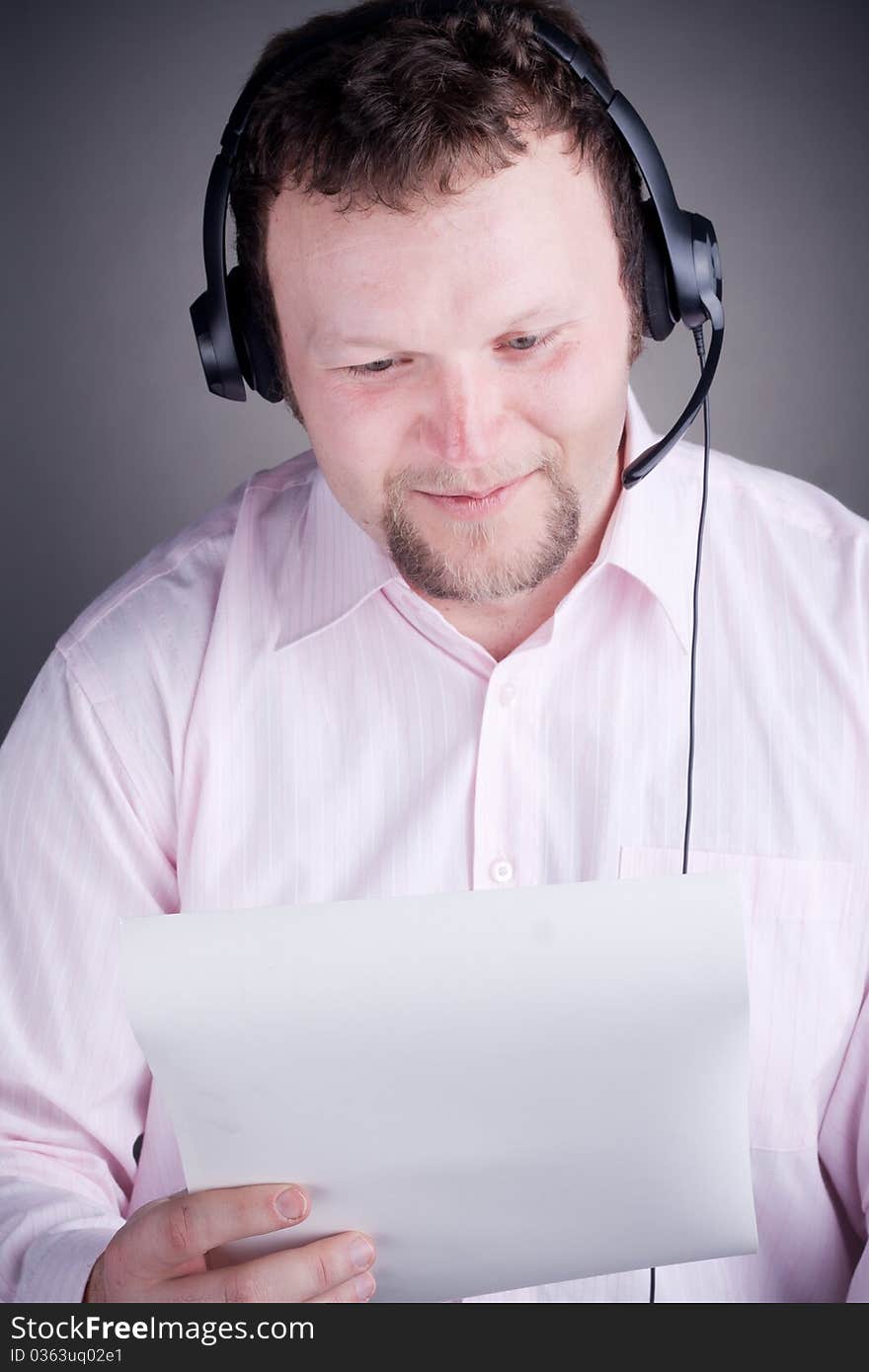 Smiling male customer service operator in headset