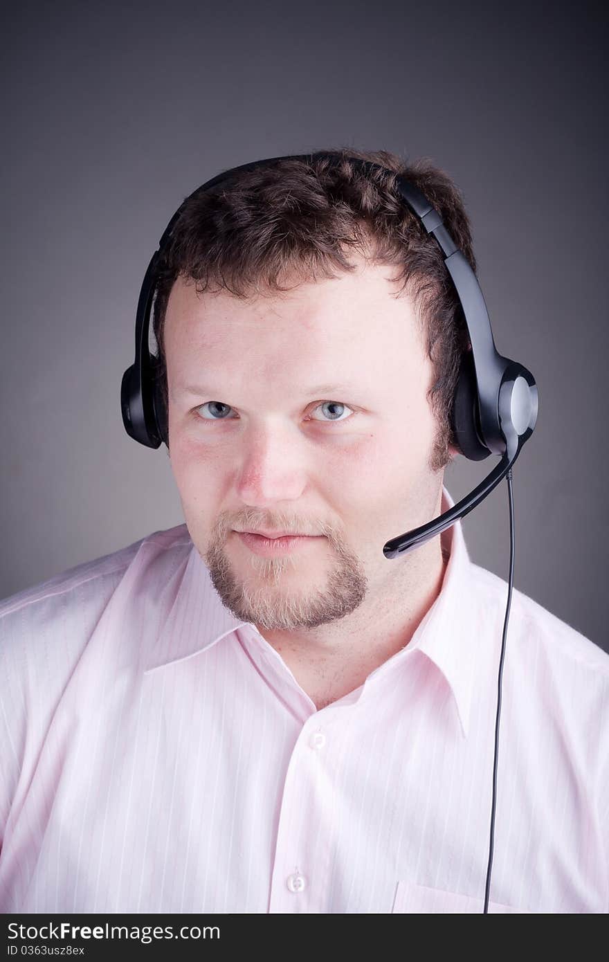 Smiling male customer service operator in headset