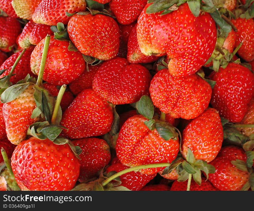 Red juicy strawberries closeup, background