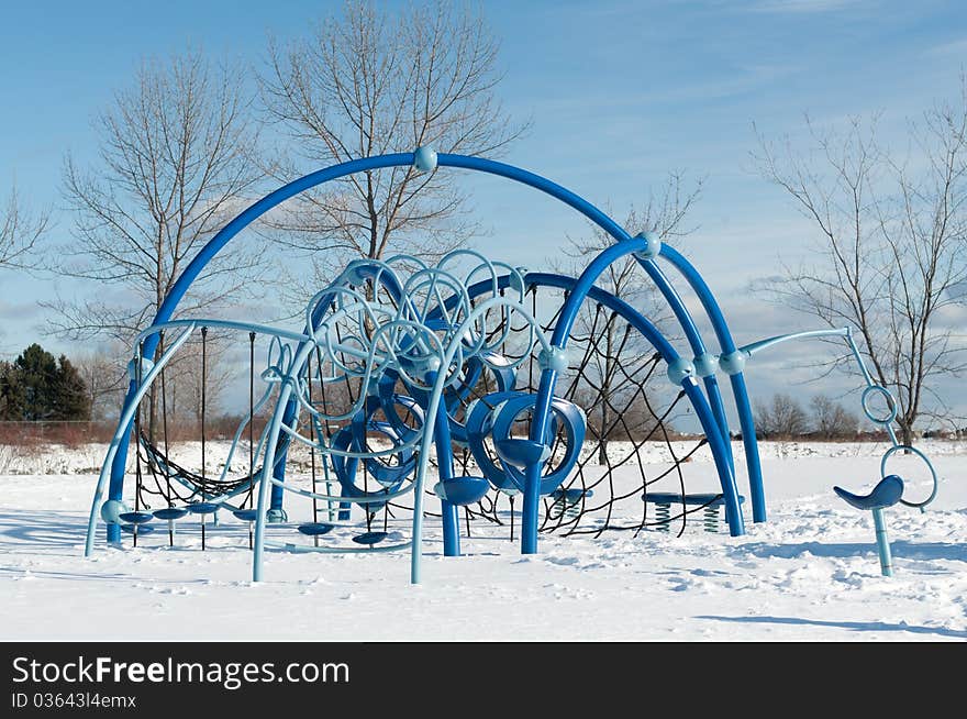 A play structure at a childrens' playground in winter. A play structure at a childrens' playground in winter.