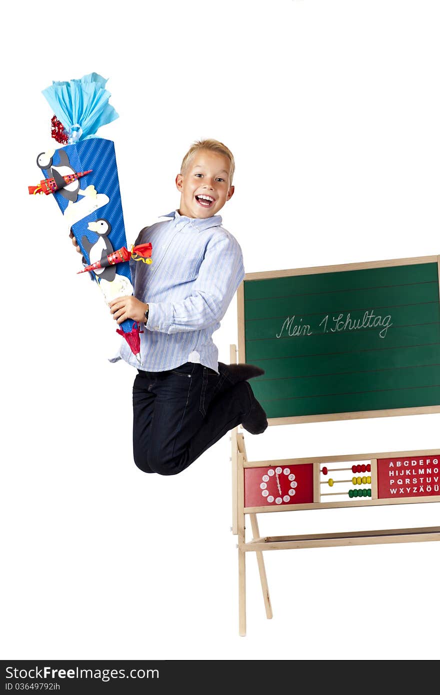 Boy on first school is happy and jumps in the air. Isolated on white background.