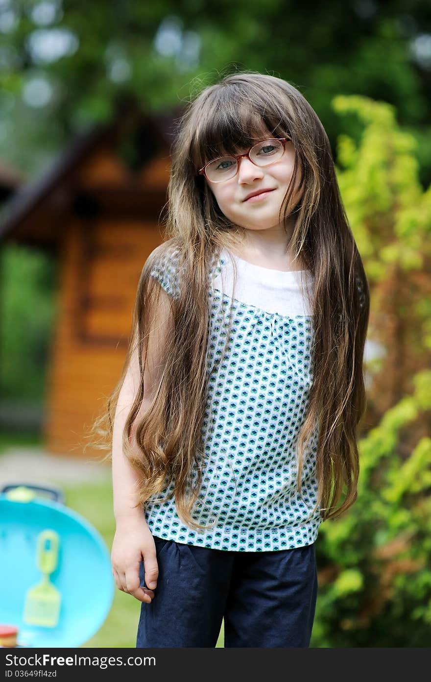 Girl with long hair play with toy