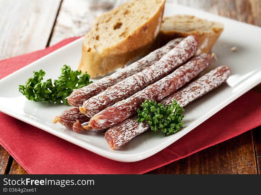 Small salamis on a plate