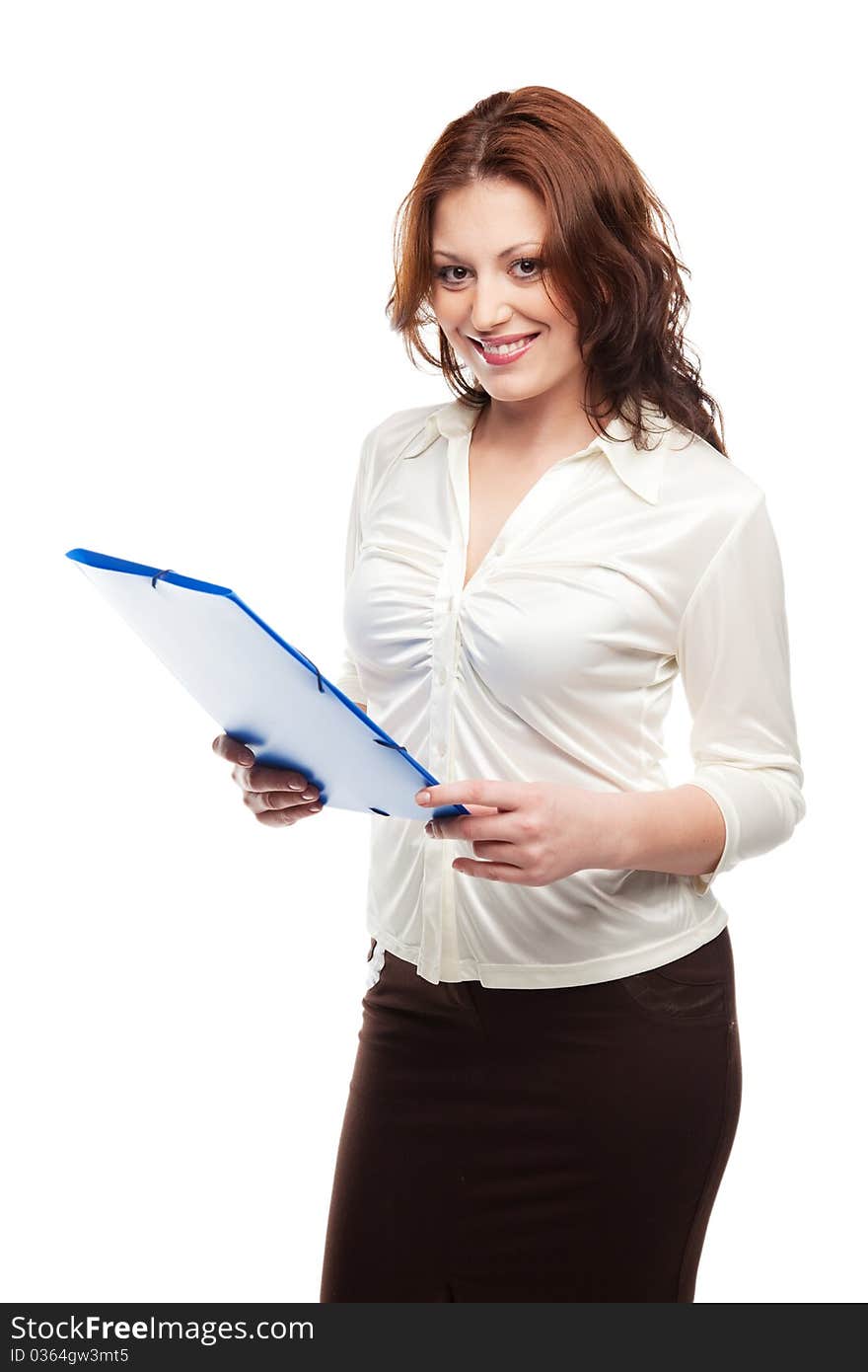 Beautiful business woman in a white blouse and skirt looks at the blue folder in his hands, isolated on white