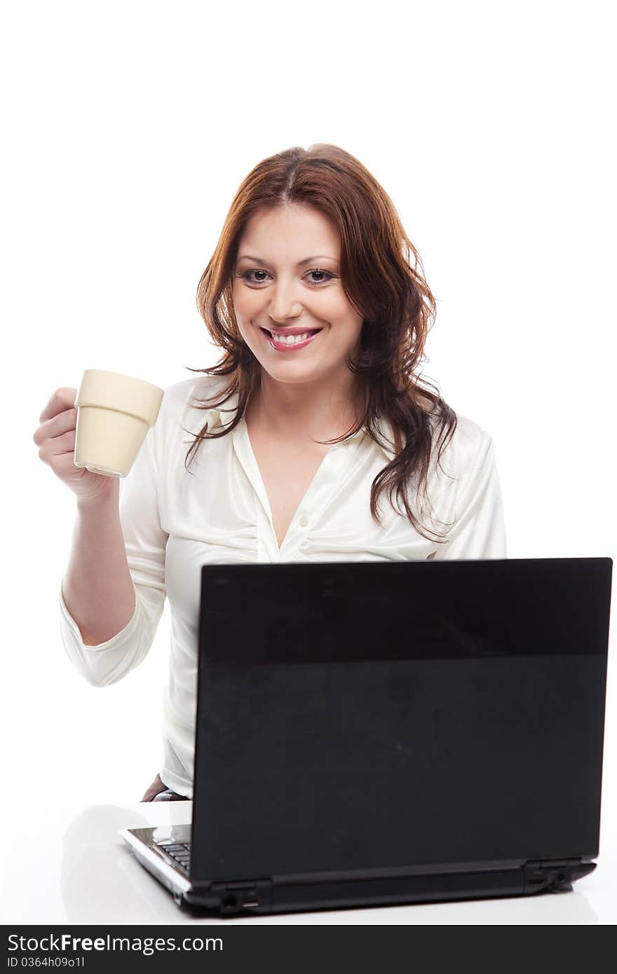 Girl Sitting At Table With Laptop And Cup