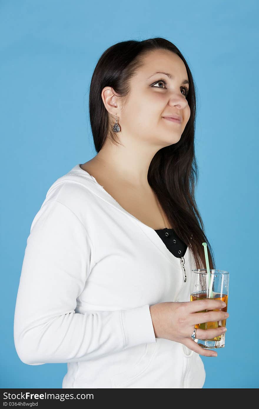 beautiful woman stands with a glass