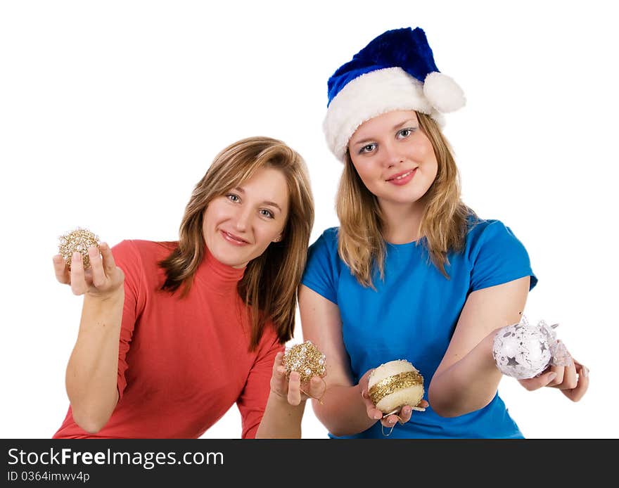 Two smiling girls with Christmas tree balls