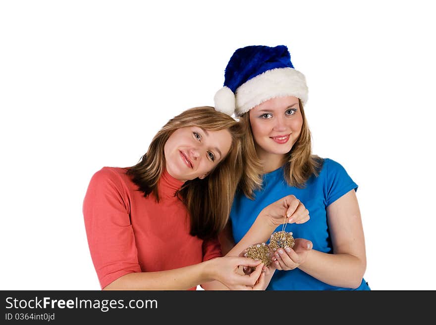 Two smiling girls with Christmas tree balls