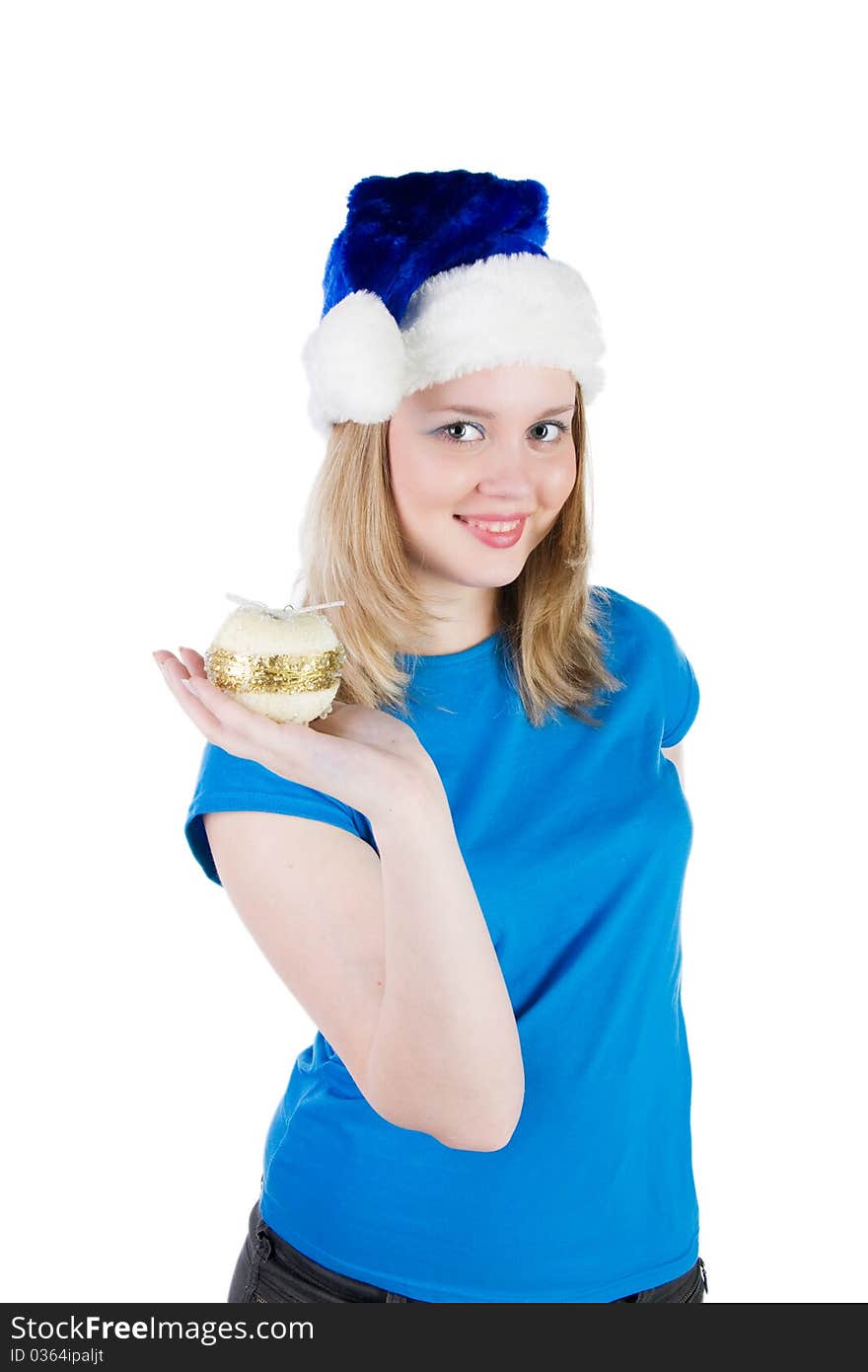 Smiling girl with Christmas tree balls and a hat of Santa Claus