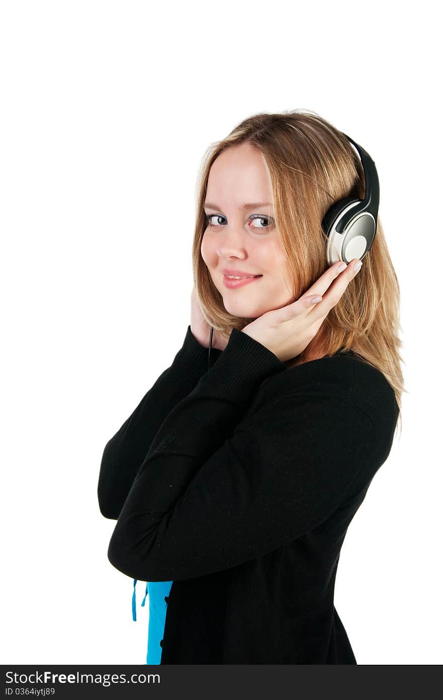 Beautiful girl listens to music, isolated on white