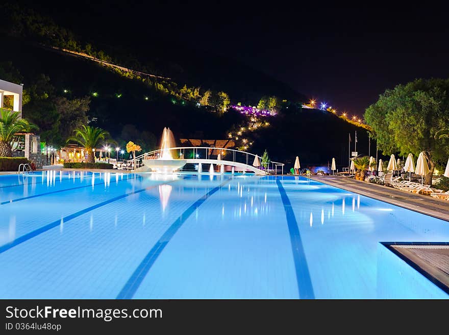 Water Pool And Fountain At Night