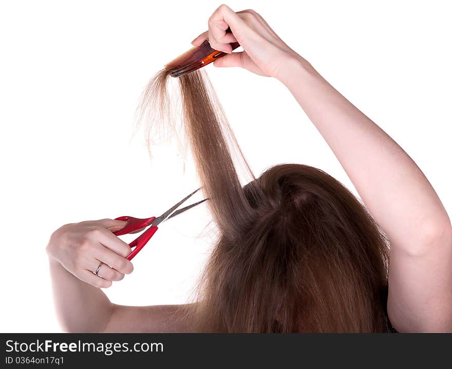 Woman with long hair and scissors on white