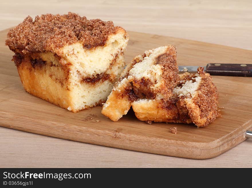 Sliced crumb cake bread on a cutting board