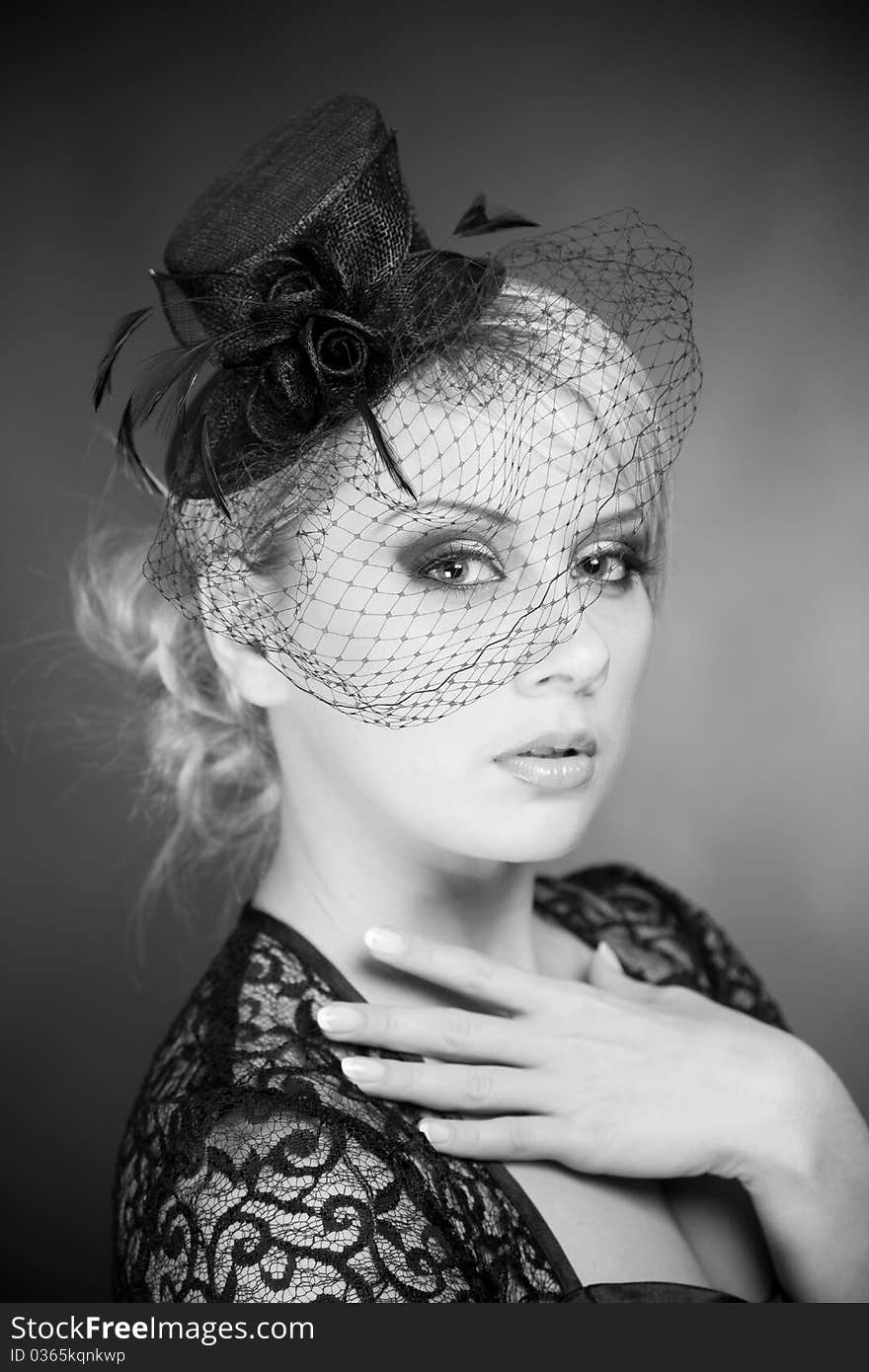 Monochrome portrait of elegant woman, studio shot