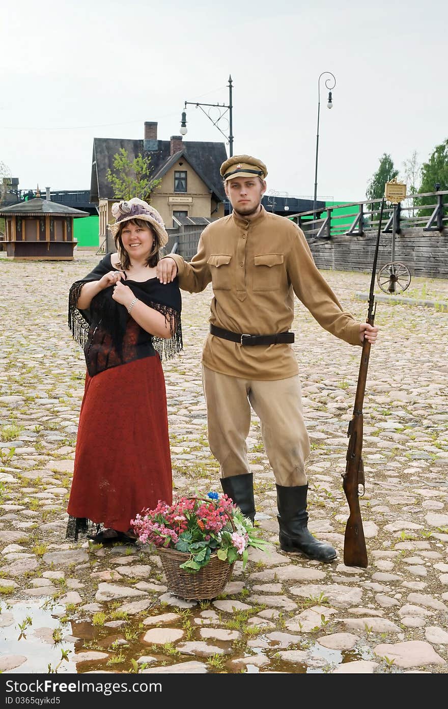 Couple of lady and soldier shown on retro-style picture. Costumes accord the times of World War I. Photo made at cinema city Cinevilla in Latvia. Couple of lady and soldier shown on retro-style picture. Costumes accord the times of World War I. Photo made at cinema city Cinevilla in Latvia.